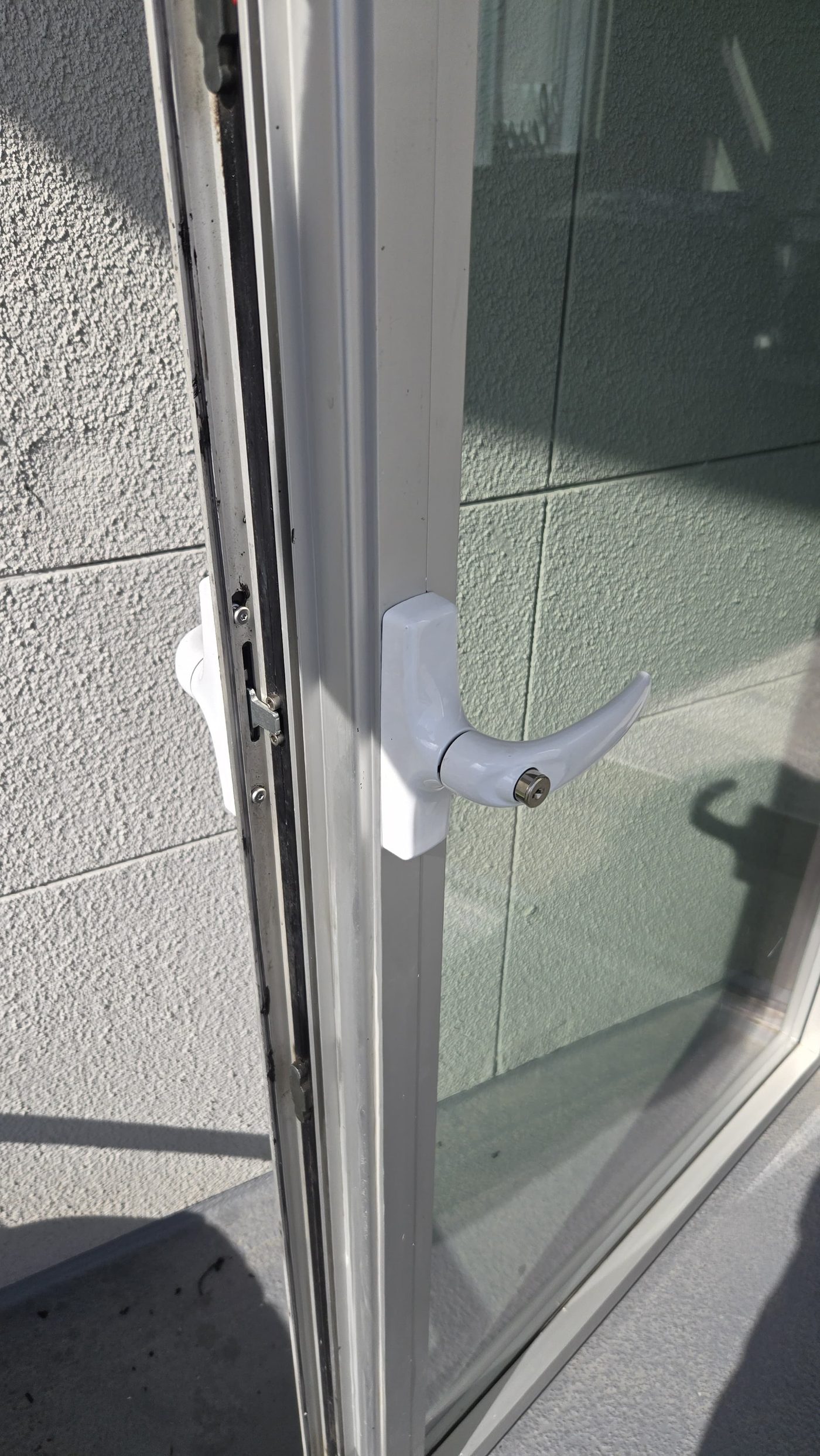 New keyed handle installed on a high-rise patio door