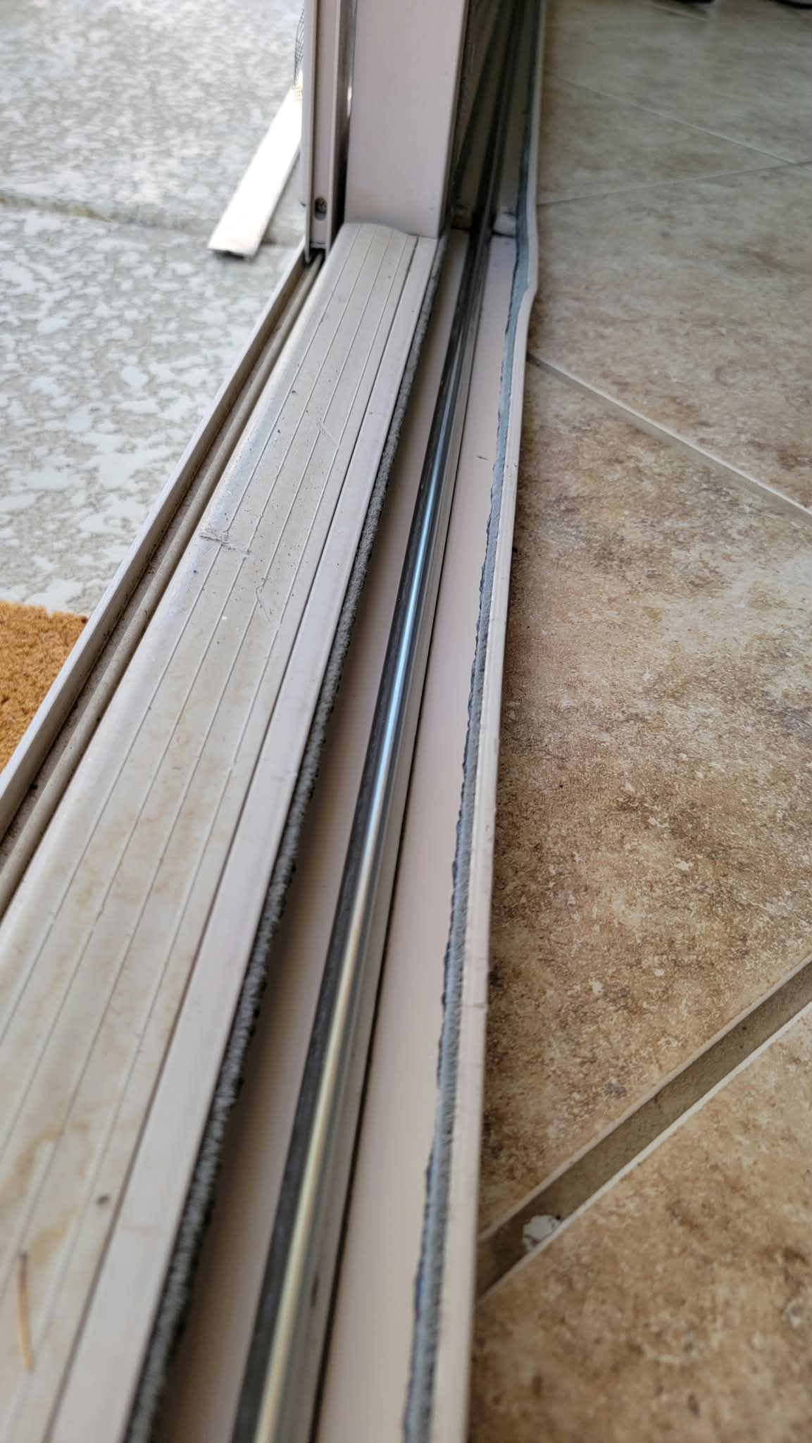 Sliding door track after roller replacement